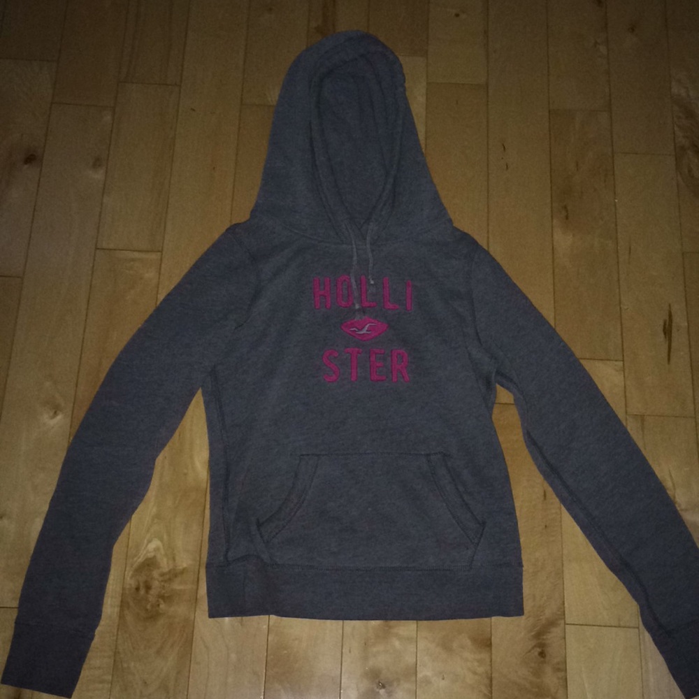 Gray hoodie with pink sewn on letters